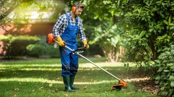 Person Driving a Lawnmower